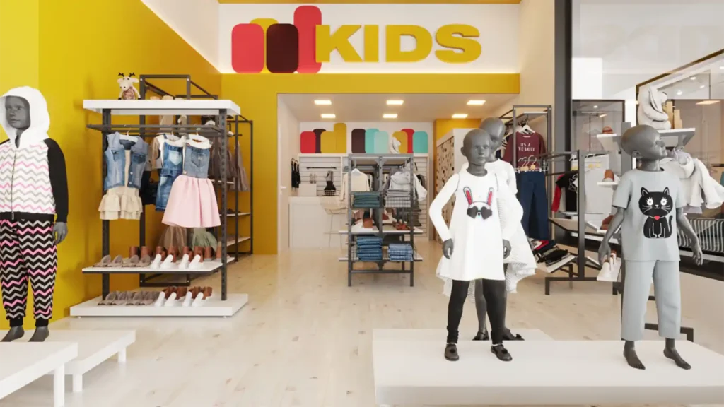 Interior de uma loja infantil com decoração vibrante, destacando-se o chão de madeira clara e paredes amarelas. À esquerda, manequins infantis exibem roupas coloridas, enquanto prateleiras com sapatos e acessórios complementam a exposição. O logo 'kids' em vermelho, laranja e rosa está fixado na parede amarela ao fundo, e à direita mais roupas estão penduradas em araras e prateleiras de tecidos e livros infantis visíveis ao fundo, criando um ambiente acolhedor para compras em família. A foto é um exemplo de ambiente com decoração para loja infantil.